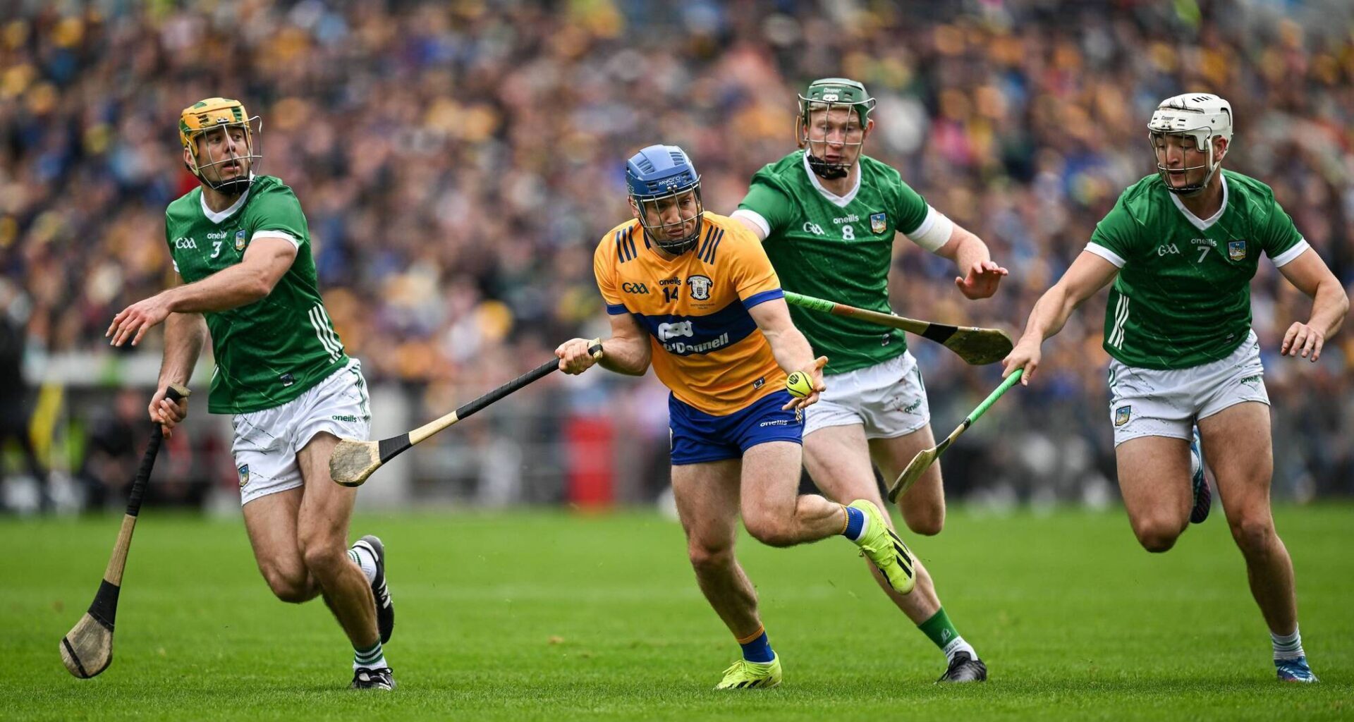 9 June 2024; Shane O'Donnell of Clare in action against Limerick players, from left, Dan Morrissey, Will O'Donoghue and Kyle Hayes during the Munster GAA Hurling Senior Championship final match between Clare and Limerick at FBD Semple Stadium in Thurles, Tipperary. Photo by Brendan Moran/Sportsfile