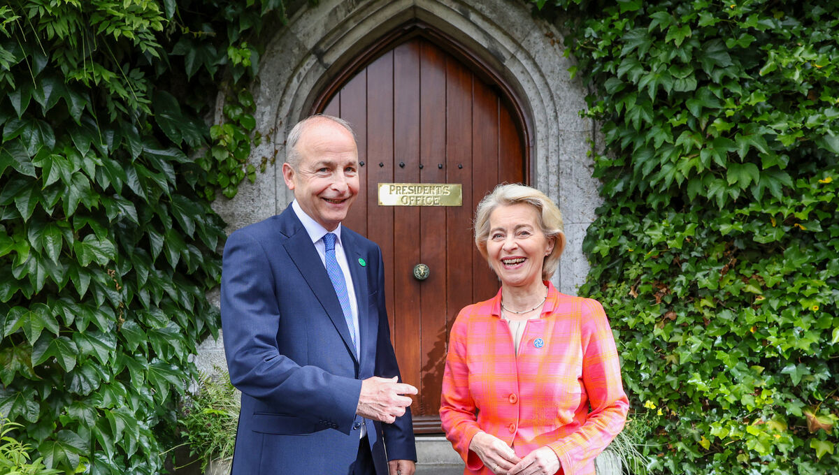European Commission president Ursula von der Leyen and Taoiseach Micheál Martin pose for a photo outside the president’s office door at University College Cork.