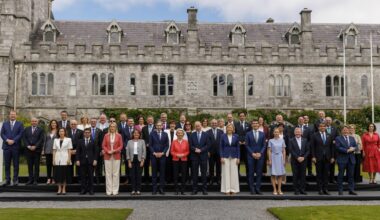Tánaiste Simon Harris (front row,centre left), Taoiseach Micheál Martin (front row, centre right) and European Commission president Ursula von der Leyen (front row, centre) pose for a family photo with government ministers and the 27 EU commissioners at University College Cork as Ireland begins its presidency of the EU Council. Picture: Liam McBurney/PA
