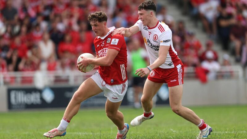 Cork's Tom Whooley powers past the Tyrone challenge of Matthew J Daly. Pic: Bryan Keane, Inpho