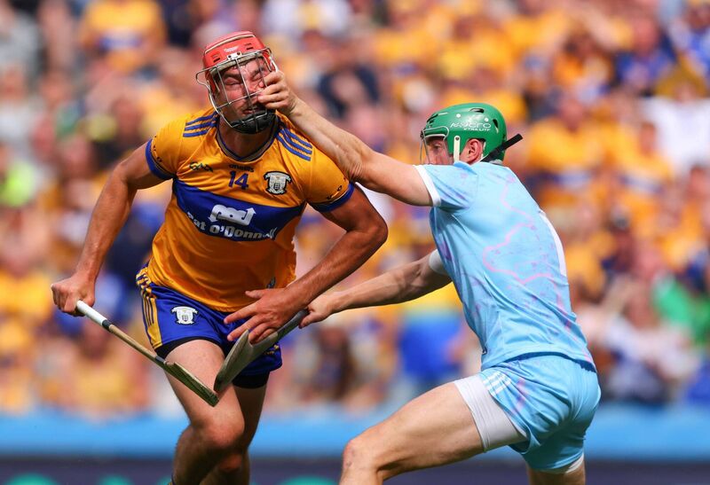 Clare's Peter Duggan is fouled by Nickie Quaid. Pic: Tom O’Hanlon/Inpho