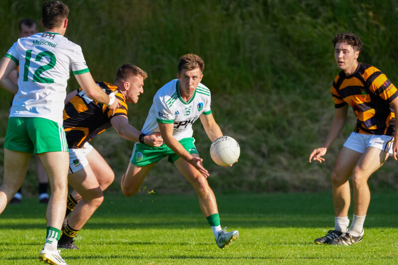 Muskerry’s Liam Twohig negotiates a tackle from the Avondhu defence. Picture: Noel Sweeney
