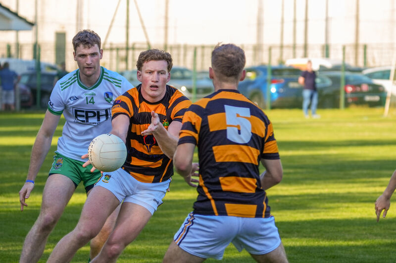  Colin O'Brien finds support as Muskerry’s Cillian Donovan closes in. Picture: Noel Sweeney