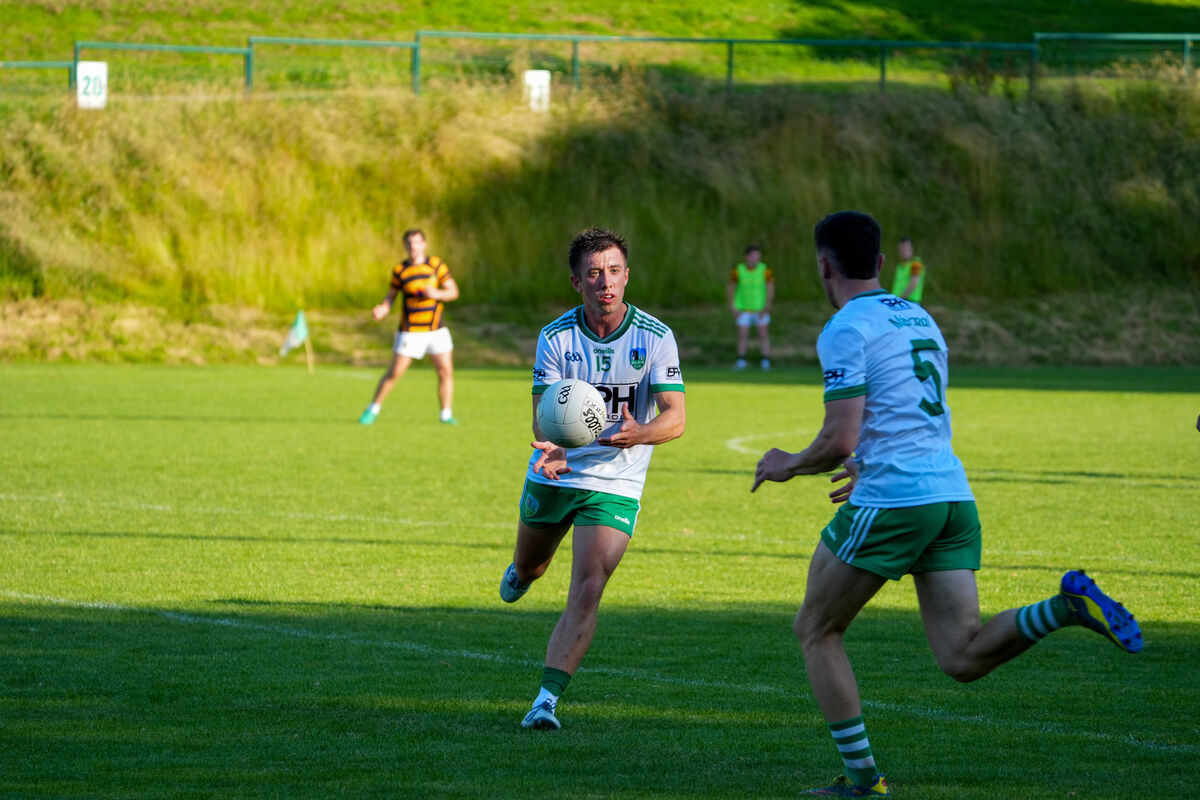 Muskerry’s Liam Twohig finds support in his team mate Conor Dodd against Avondhu. Picture: Noel Sweeney