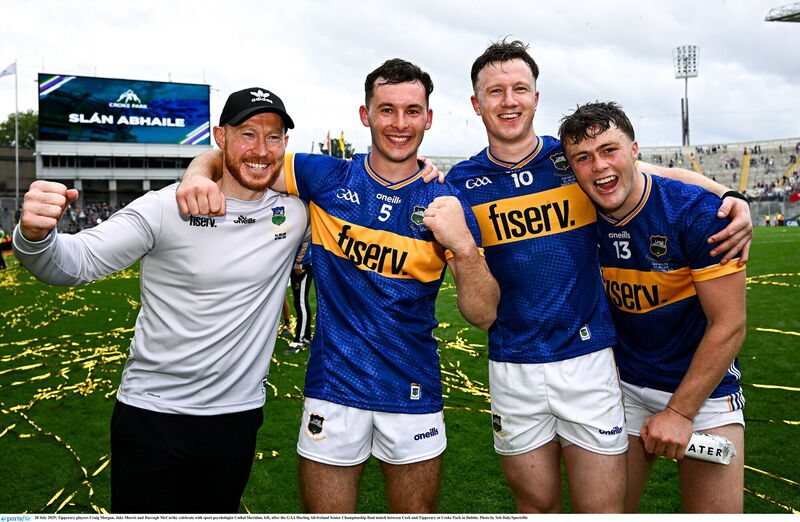 Tipperary players Craig Morgan, Jake Morris and Darragh McCarthy celebrate with sport psychologist Cathal Sheridan in 2025. Picture: Seb Daly/Sportsfile