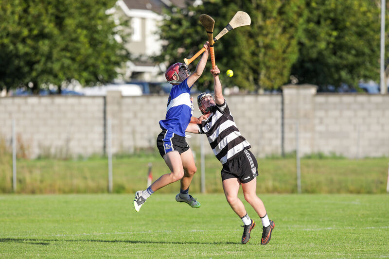 Seán Carey of Sarsfields and Midleton's John O'Sullivan contest aerial possession. Picture: David Creedon