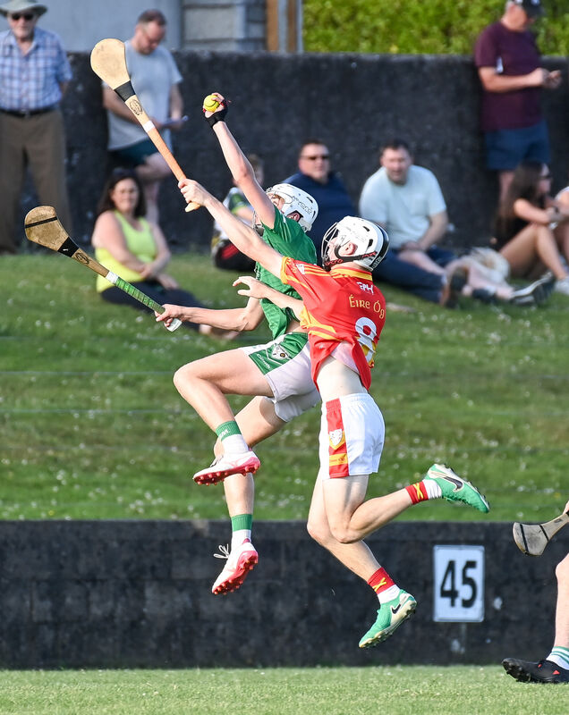  Killeagh's Andrew Brenner goes high to win possession ahead of John O'Sullivan of Eire Og during their U18 Premier 2 Hurling League final at Carrigtwohill. Picture: David Keane.
