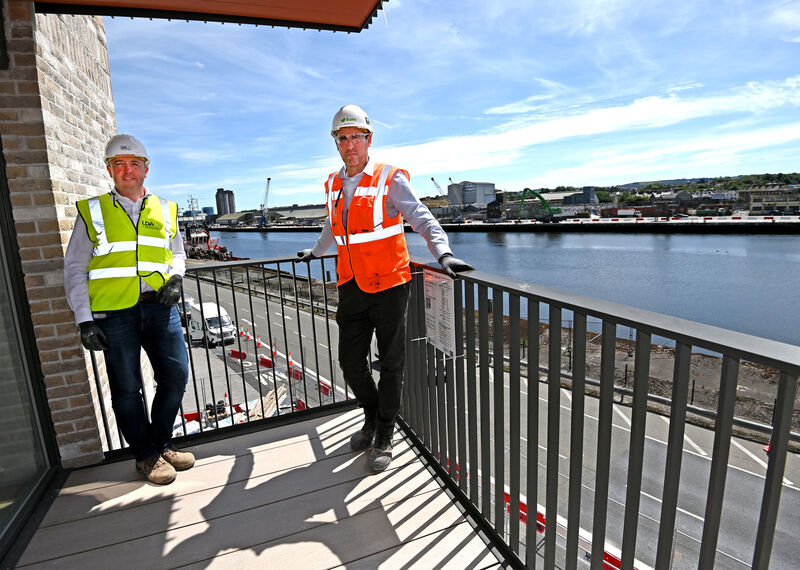 Phelim O'Neill, (left) director of development LPA and Shaun McGinley, construction director BAM on the balcony of a two bed at Horgan's Quay apartments, overlooking The River Lee. Picture: Eddie O'Hare
