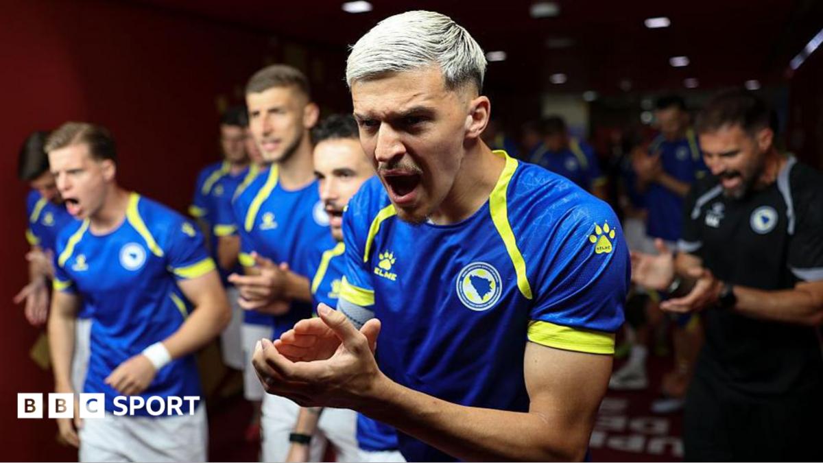 Tarik Muharemovic clapping his hands when walking out for Bosnia and Herzegovina