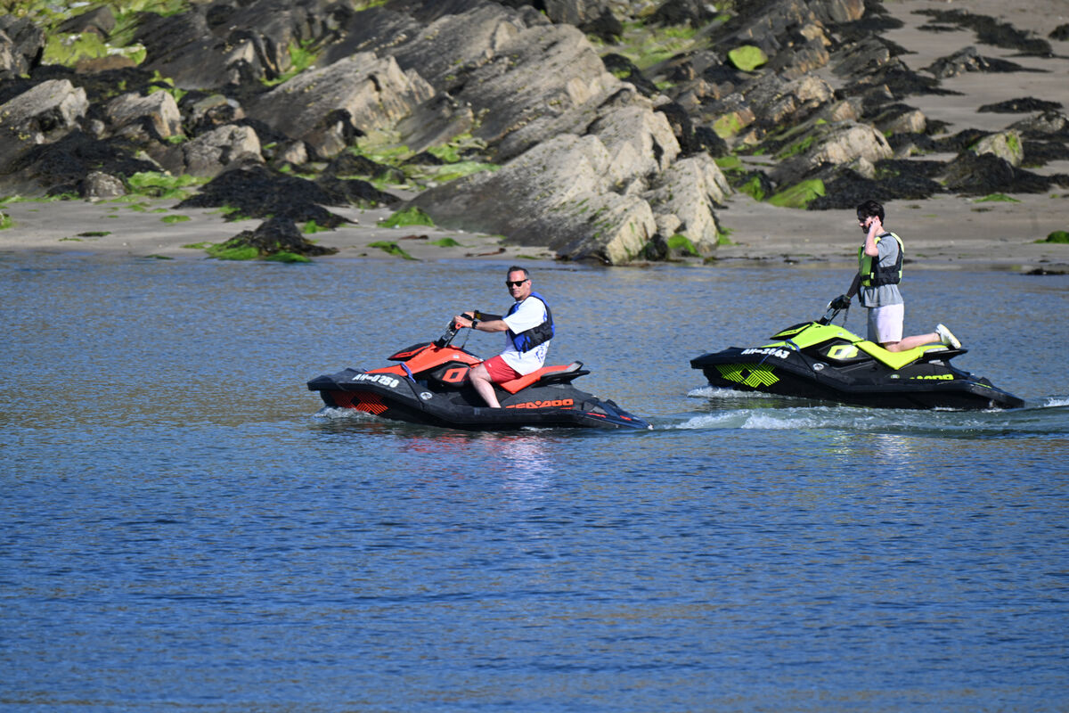  Jetskiers slowly pass Sandycove Island at Sandycove, Kinsale, Co Cork. Ireland will see temperatures climbing to the high 20s and early 30s celsius in some places this weekend. Picture: Larry Cummins