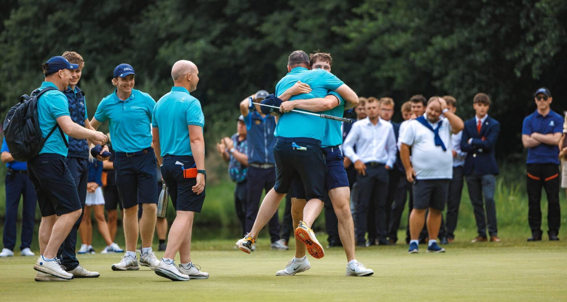 Thomas Higgins celebrates with teammates after sinking the winning put on the 20th hole to secure the victory for Ireland. Pic: EGA