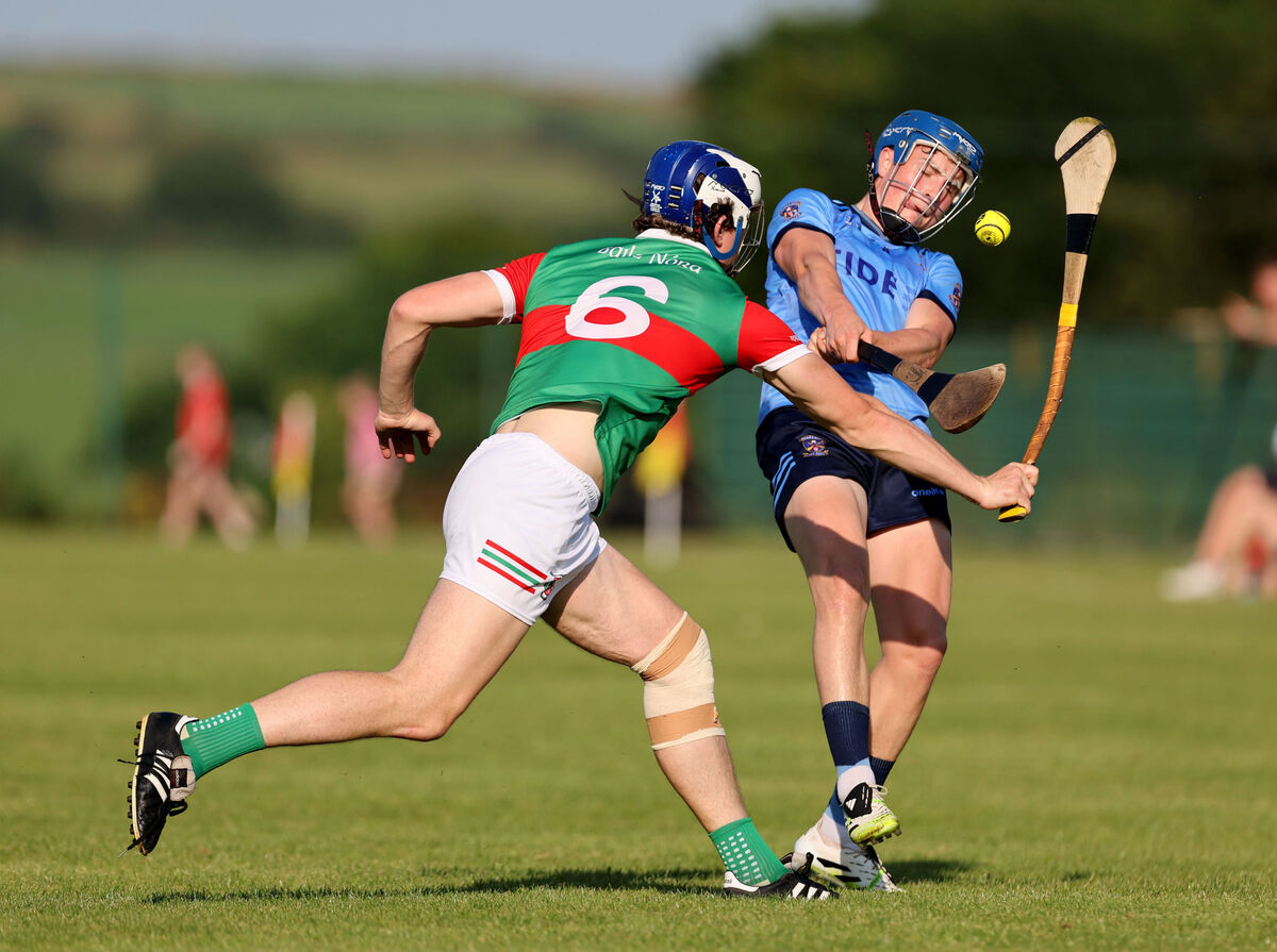  James Lordan of Ballinora gets a block on the shot of Barryroe's Tomás Ó Buachalla. Picture: Jim Coughlan