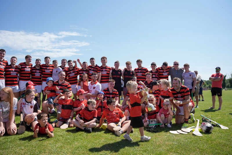 Tom O’Sullivan, son of Cloyne's Paudie O’Sullivan, picks up the cup and gives it a big lift. Picture: Noel Sweeney