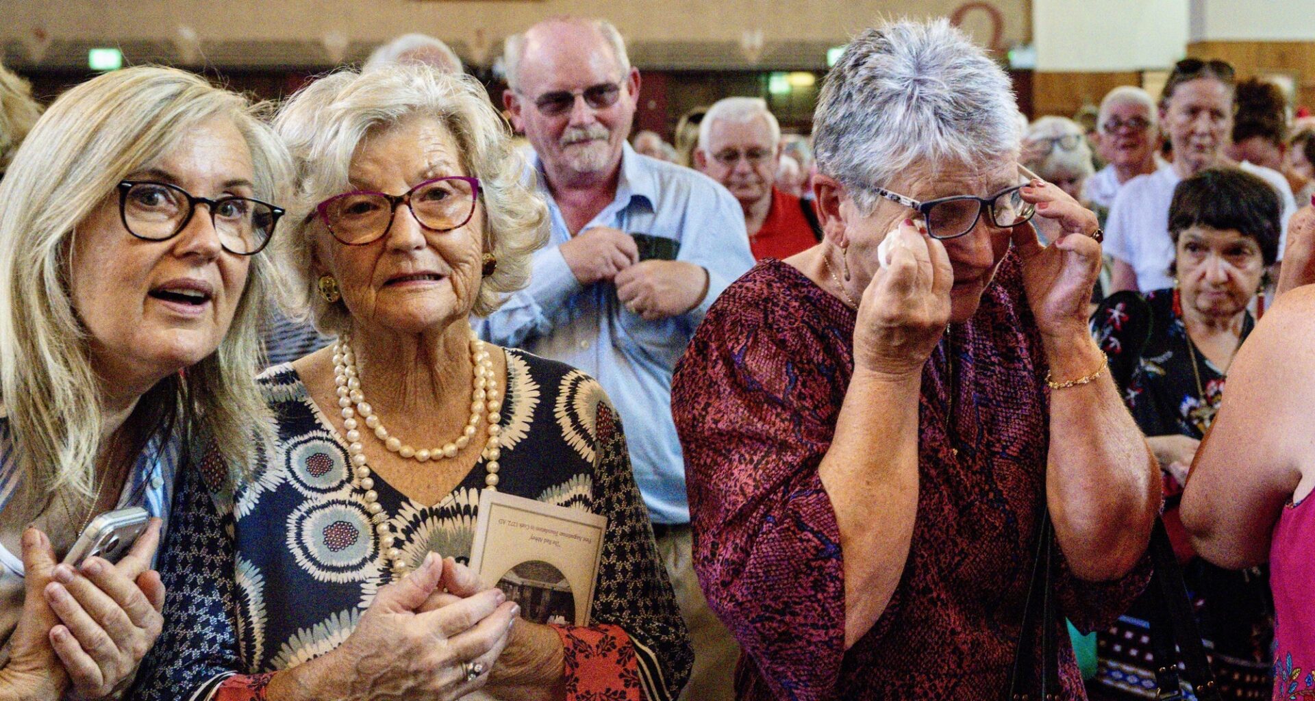 One member of the congregation wipes away a tear during the emotional final Mass at St Augustine’s Church in Cork. The church officially seats 1,200, but one priest estimated the congregation spilling out into Washington Stand the Grand Parade was close to 2,000. Pictures: Chani Anderson