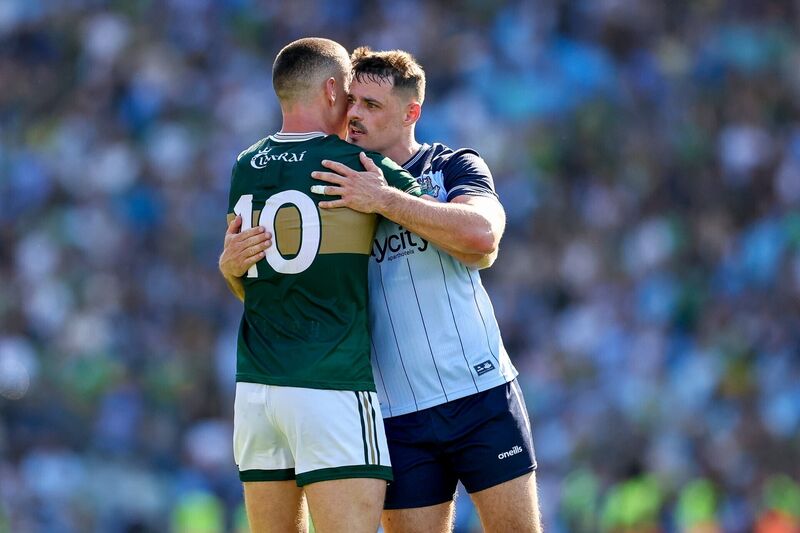 Dublin's Brian Howard embraces Kerry's Joe O’Connor after the match. Pic: ©INPHO/James Crombie