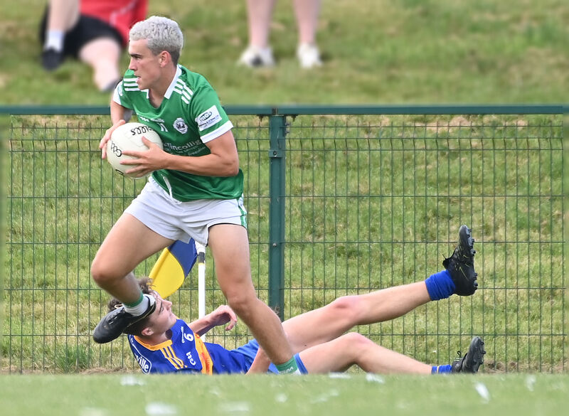 Ballincollig's Joe Miskella leaves Carrigaline's David Scannell-Murphy on the ground. Picture: Eddie O'Hare