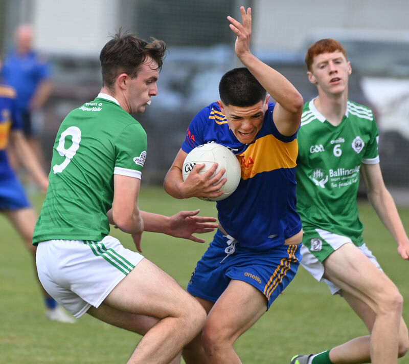 Carrigaline's Ollie Lynch holds onto the ball from Ballincollig's Conor Cogan. Picture: Eddie O'Hare