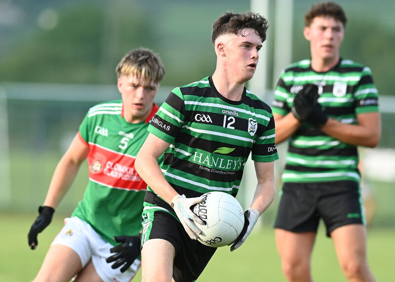 Douglas's Tomás Reddington slips past Shay O'Donovan of Clonakilty. Picture: Martin Walsh