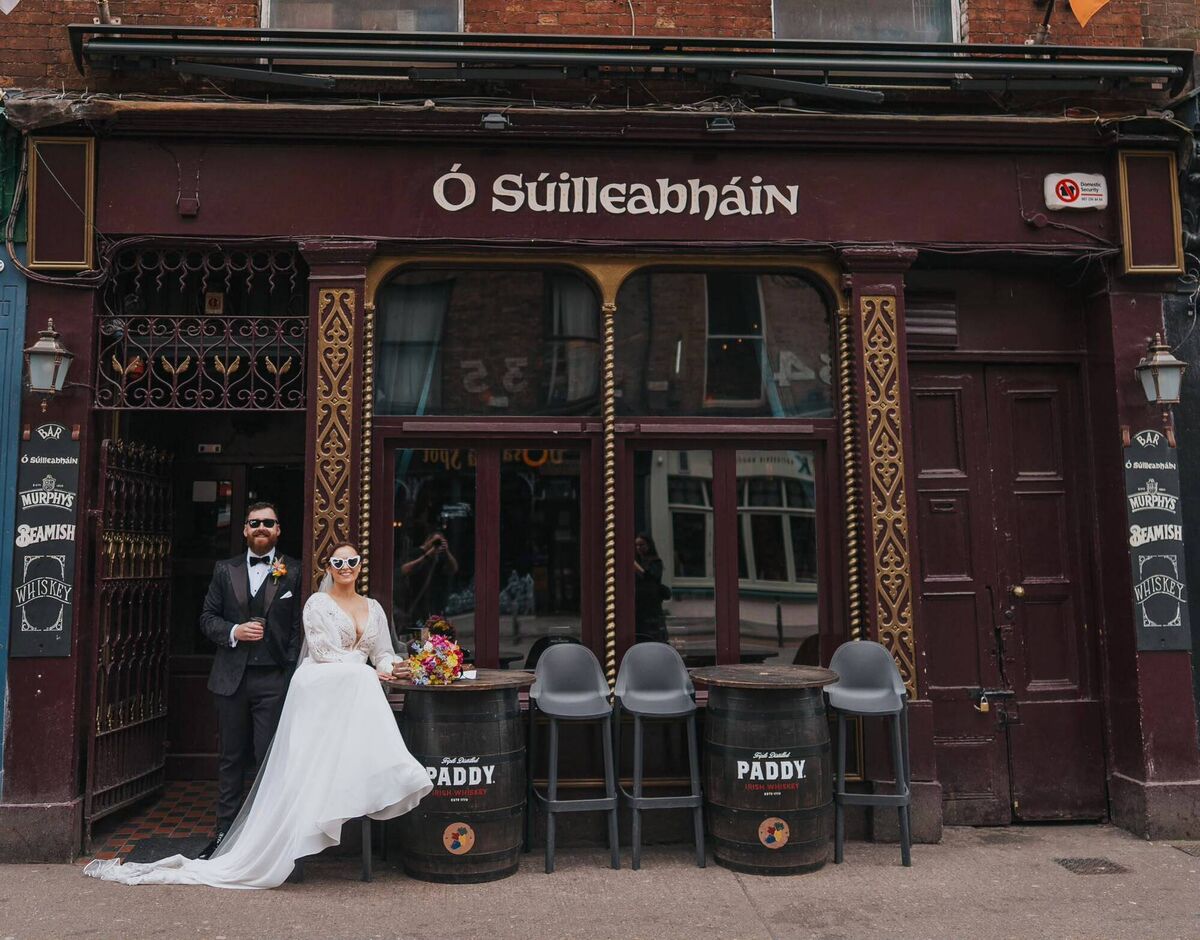 Darragh Bermingham and Kiva Sammon outside Ó Súilleabháin's bar on their wedding day