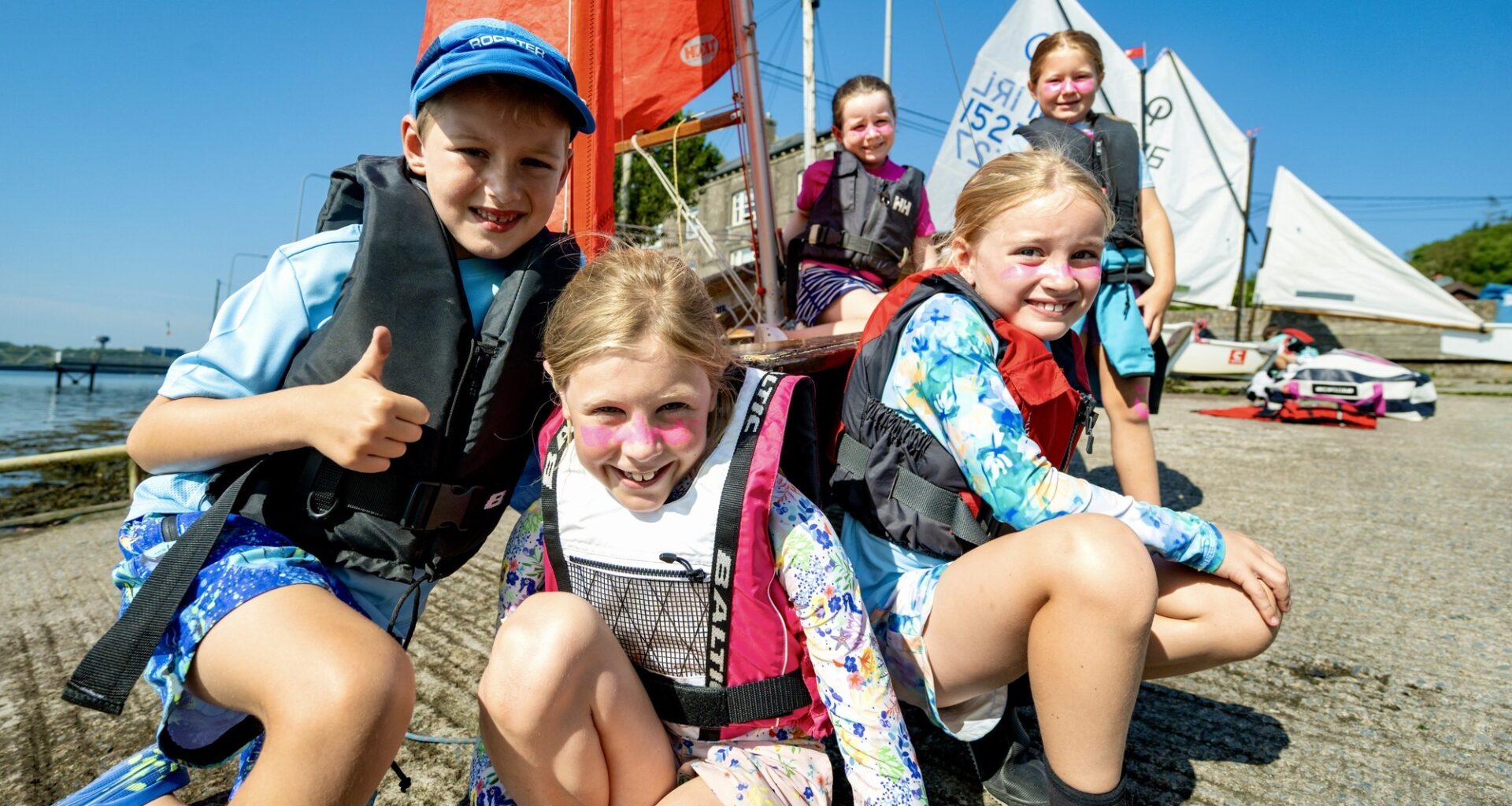 Alex Dwyer, Xanthe Kennelly, Catherine McDevitt, Caroline Kennelly and Juliette Cotter enjoy the sunshine during a sailing camp in Monkstown. Picture: Chani Anderson