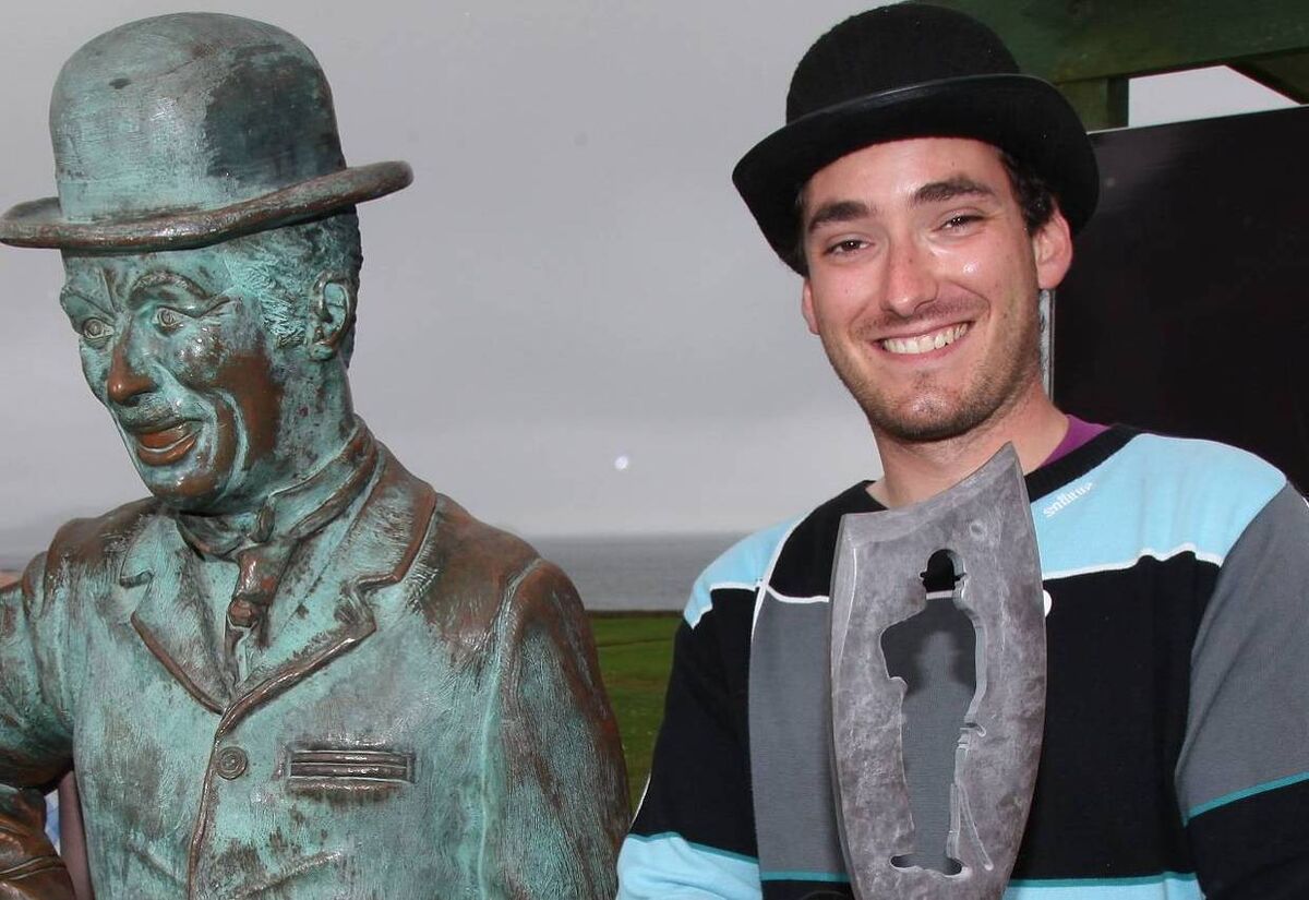 The Charlie Chaplin Festival in Waterville unveils their 'Charlie Award'. Arthur Gardin Charlie Chaplin's grandson, Josephine's son,  with his statue. Picture: AJLPhoto.