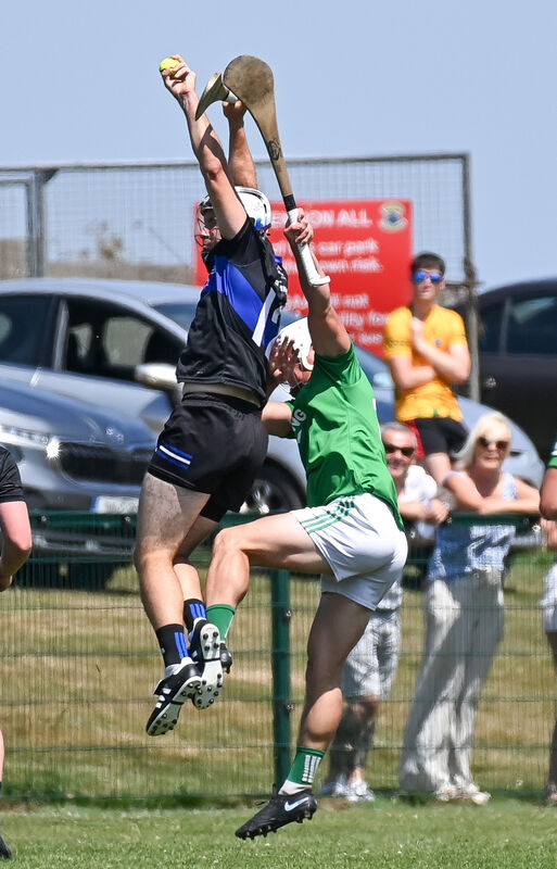  Sarsfields' Cian McCarthy goes high to win possession ahead of Aghada's Kyle O'Shea during their Division 6 Hurling League final in Cobh.