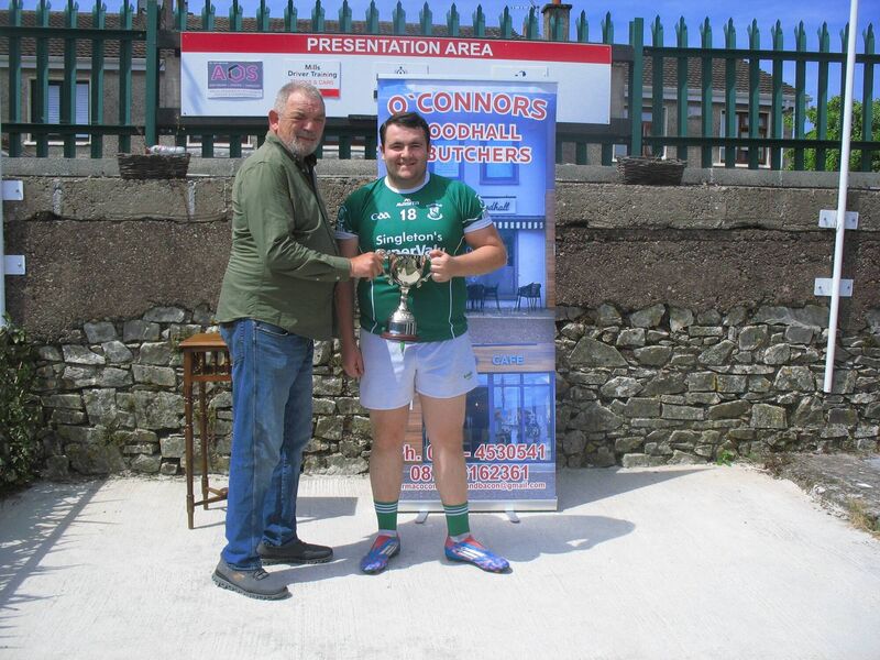Seandún chairman Mick Buckley presenting the Cormac O'Connor Butchers & Foodhall Croabh Rua Cup to St Vincent's captain Darren Fitzgerald at Ballinlough.