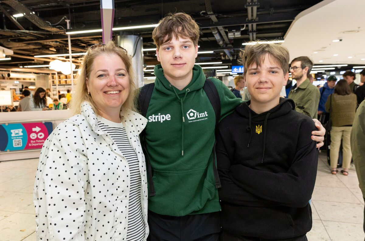 Member of Team Ireland Vitalii Halushko (centre) is greeted by his mother Halyna Halushko and brother Oleksandr Halushko all from Blanchardstown after arriving from China at Dublin Airport. Photo: Gareth Chaney