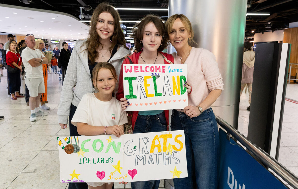 Sinead McAuliffe (right) with her daughters (left to right) Aibhaín, Ali Rose and Isabelle waiting for Jack McAuliffe at Dublin Airport. Photo: Gareth Chaney