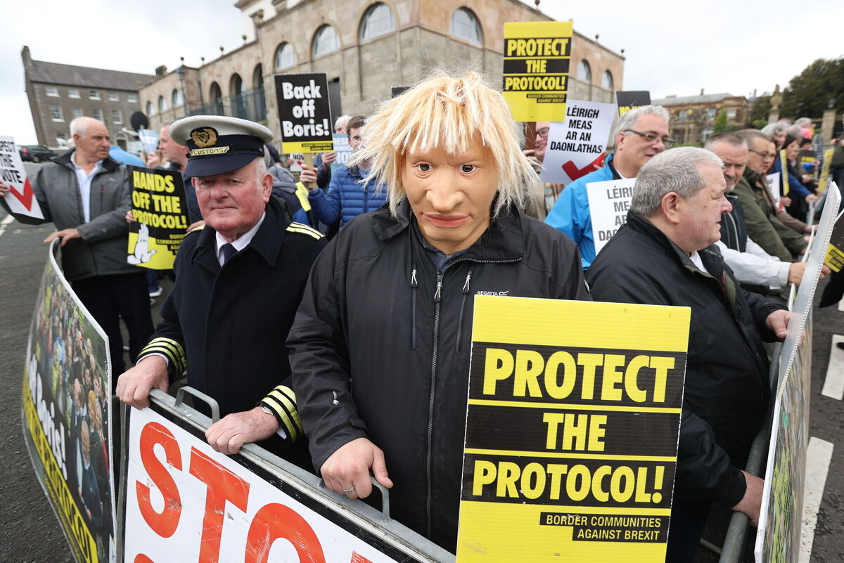 A man dressed as a customs officer and another dressed as Boris Johnson with protesters from Border Communities Against Brexit outside Hillsborough Castle in 2022 Picture: Liam McBurney/PA