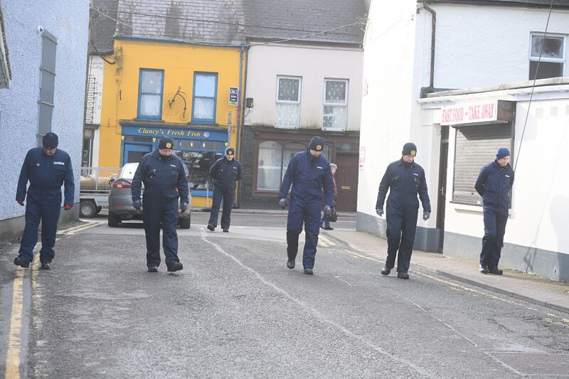 A Garda search team at Lucey's Lane, Macroom, Co Cork where the body of 61-year-old Michael Foley was discovered at his home. Picture: Larry Cummins 