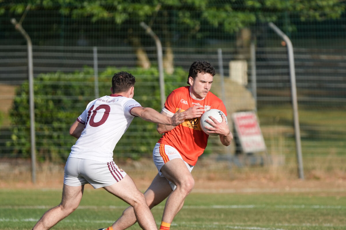 Bishopstown’s Patrick Casey tackles Éire Óg’s Daire McCarthy. Picture: Noel Sweeney
