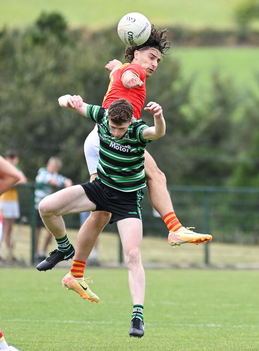  Mallow's Shane Merritt and Douglas' Adam Cantwell battle in the air during their Premier SFC clash at Grenagh. Picture: David Keane.