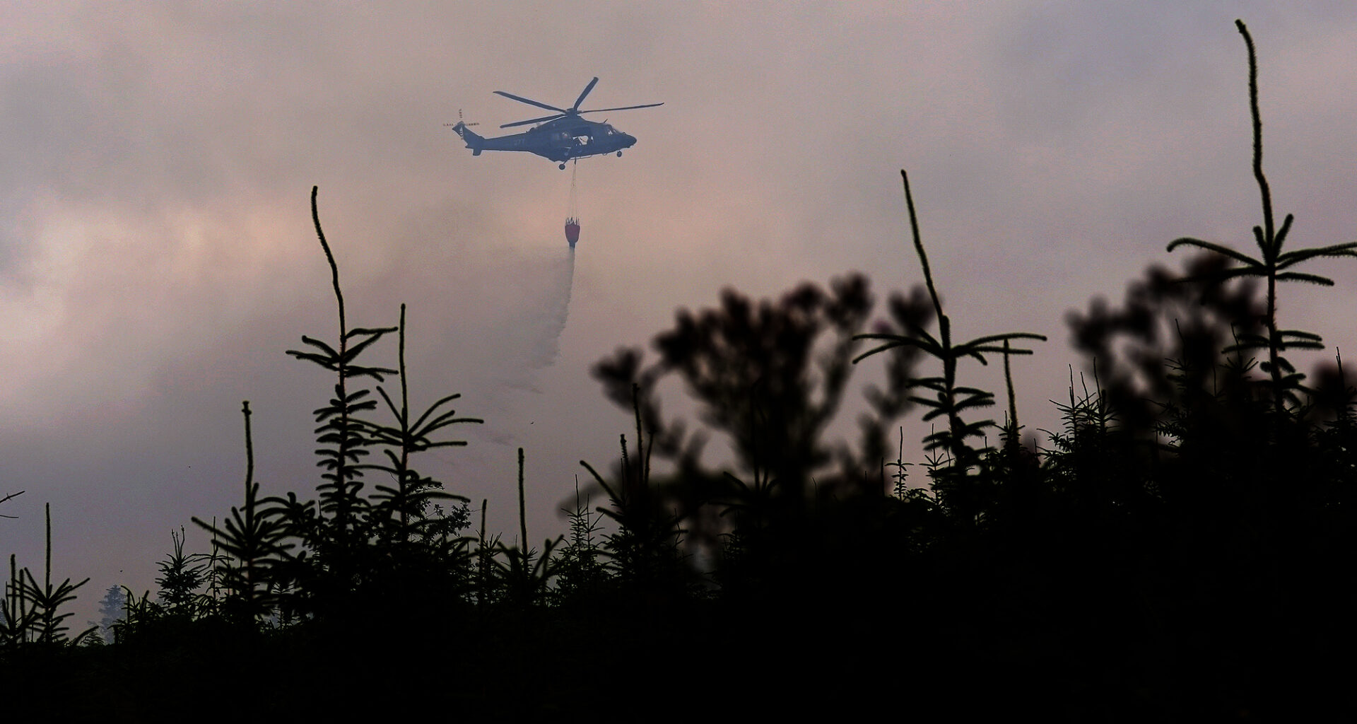 Members of the Irish Air Corps provide aerial support in tackling a major wildfire as it continues to burn at Slievenamon in Co Tipperary.
