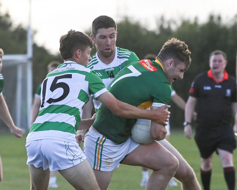  St Michael's Andrew Murphy is tackled by Valley Rovers' Shane Ryan and Eoin Delaney during their Premier SFC clash at Shanbally. Picture: David Keane