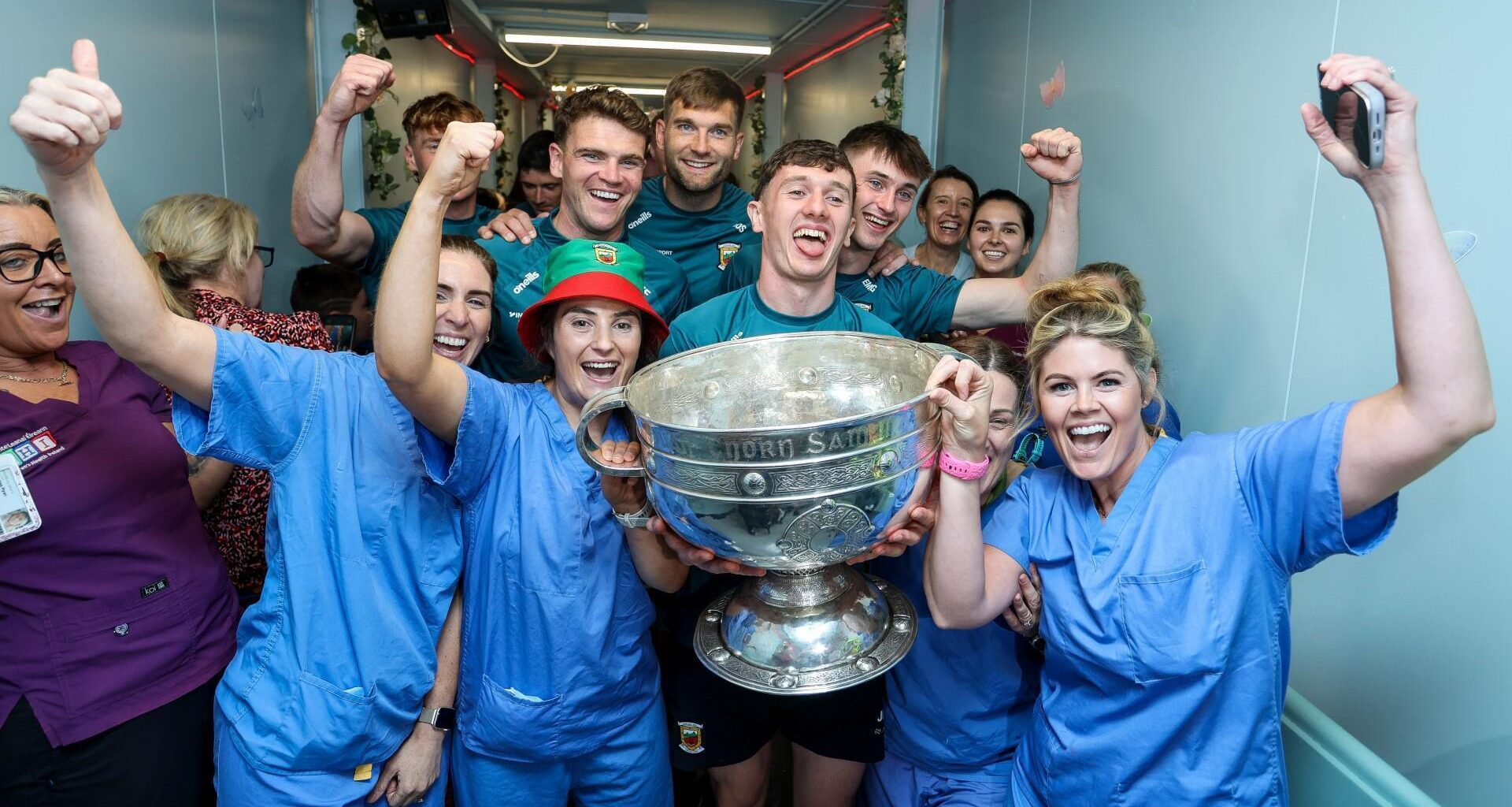 Jordan Flynn, Aidan O'Shea, Jack Coyne and Eoin McGreal with with nurses from the CHI Temple Street. Pic: ©INPHO/Tom Maher.