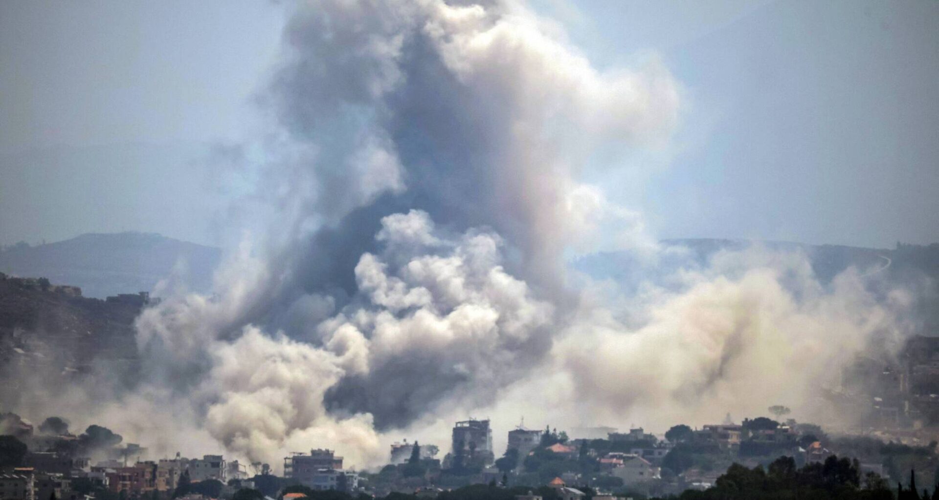 Smoke rises over the village of Kfar Tibnit in Zawtar al-Sharqiyah in southern Lebanon after a missile strike by Israeli military forces on Thursday. Picture: Ibrahim Amro/AFP/Getty