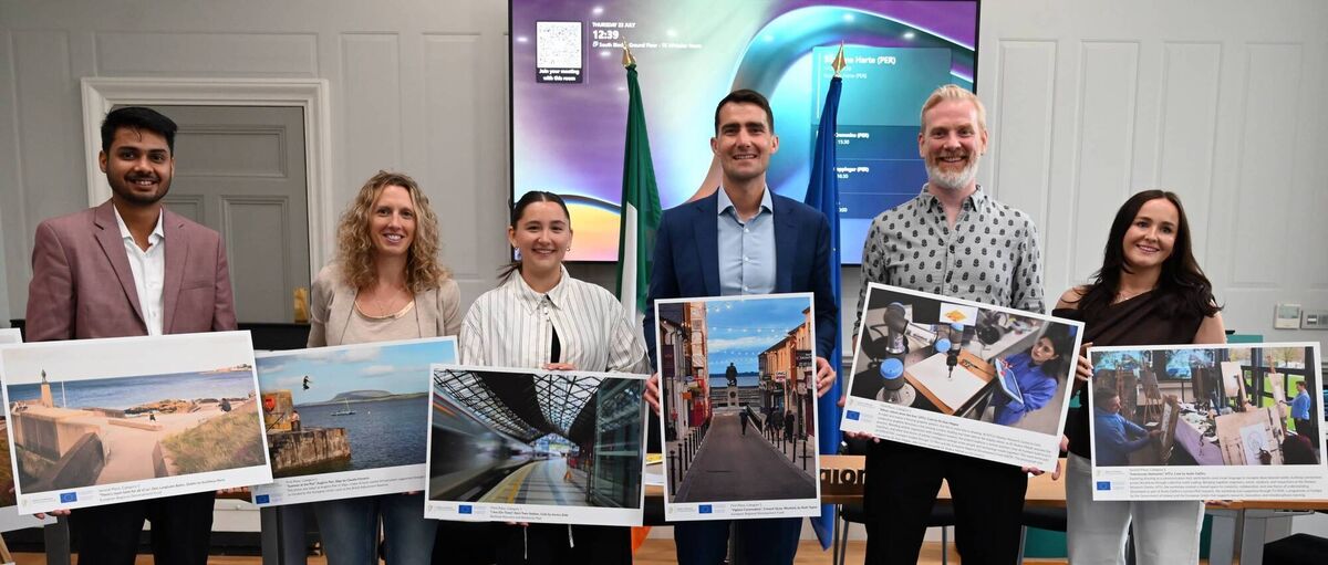 Winners holding their photos L-R: Kartikeya Rana, Claudia Finnerty, Jessica Dale, Minister Chambers holding Ruth Tapial’s photo, Dr Alan Magee and Aoife Claffey 