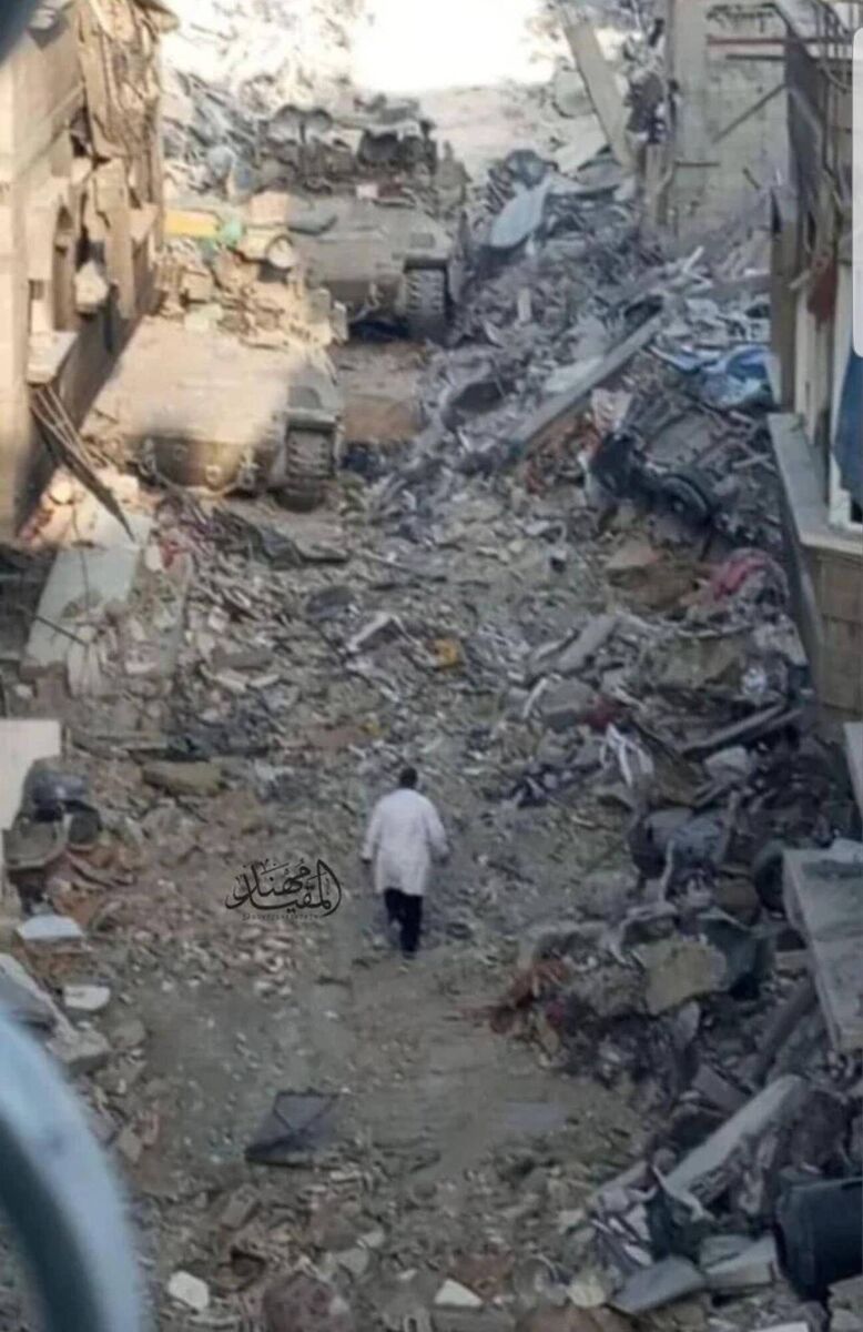 Kamal Adwan Hospital director Dr Hussam Abu Safiya walking towards Israeli army tanks prior to his arrest in 2024. Picture: @muhannad_almuqayed