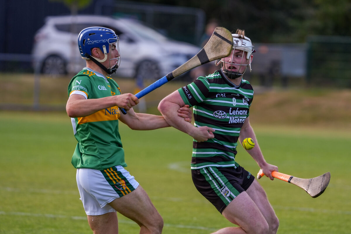 Douglas’ Jack O’Brien feels pressure from Newtownshandrum’s Robert Troy. Picture: Noel Sweeney