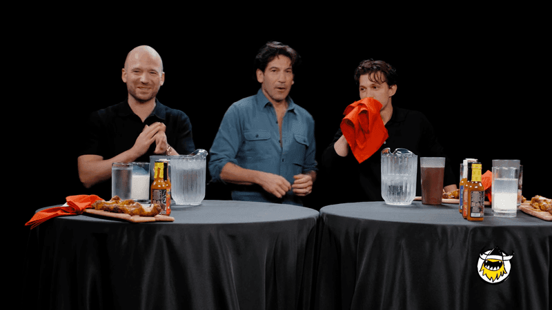 Sean Evans, Jon Bernthal and Tom Holland on "Hot Ones." (Courtesy: First We Feast/YouTube)