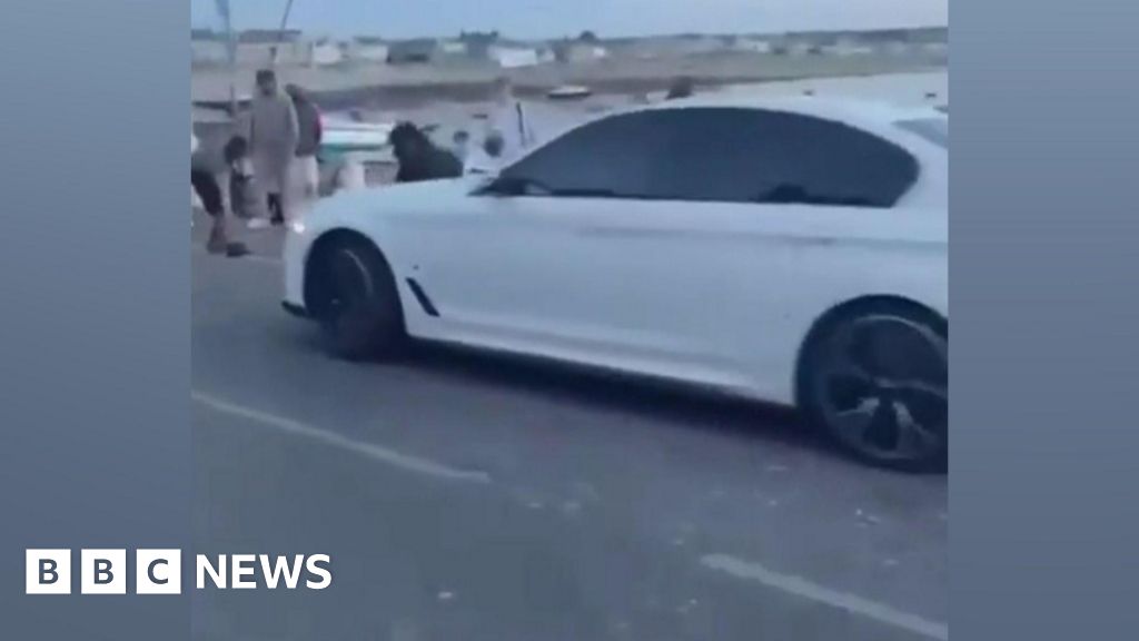 Man charged over incident where car rams into crowd - BBC