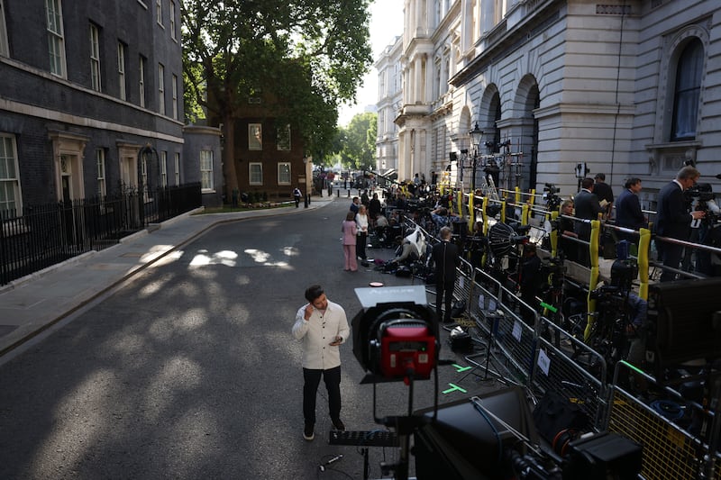 Members of the media gather at Downing Street in London. Photograph: Neil Hall/EPA