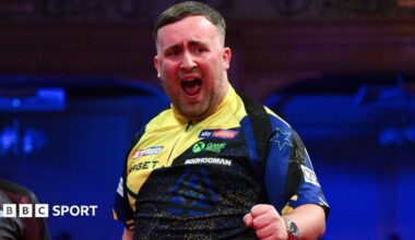 Luke Littler celebrates his nine-darter at the Winter Gardens in Blackpool