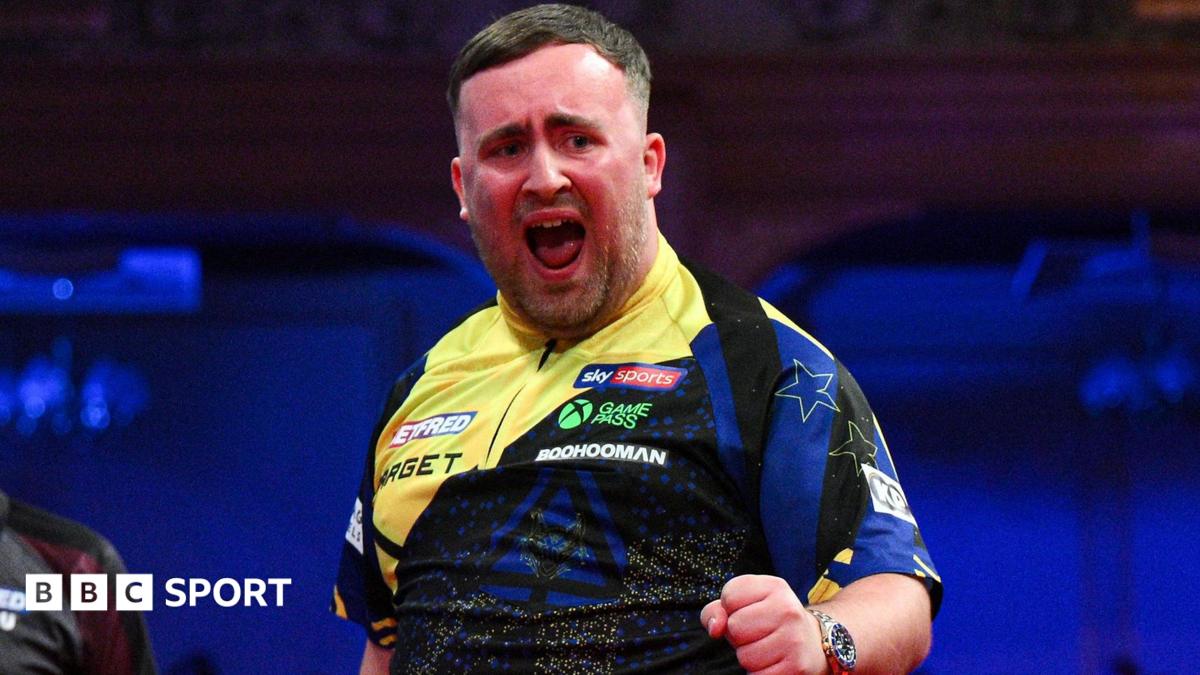 Luke Littler celebrates his nine-darter at the Winter Gardens in Blackpool