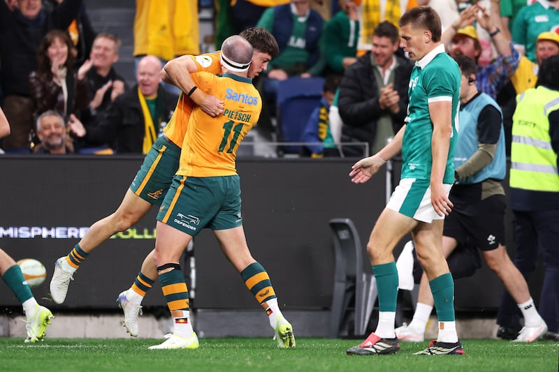 Jock Campbell of the Wallabies celebrates with Dylan Pietsch after scoring a try against Ireland. Photograph: Mark Kolbe Photography/Getty Images