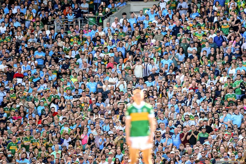 Fans look on as Kerry’s Seán O’Shea prepares to kick the winning point in the 2022 All-Ireland SFC semi-final at Croke park. Photograph: James Crombie/Inpho
