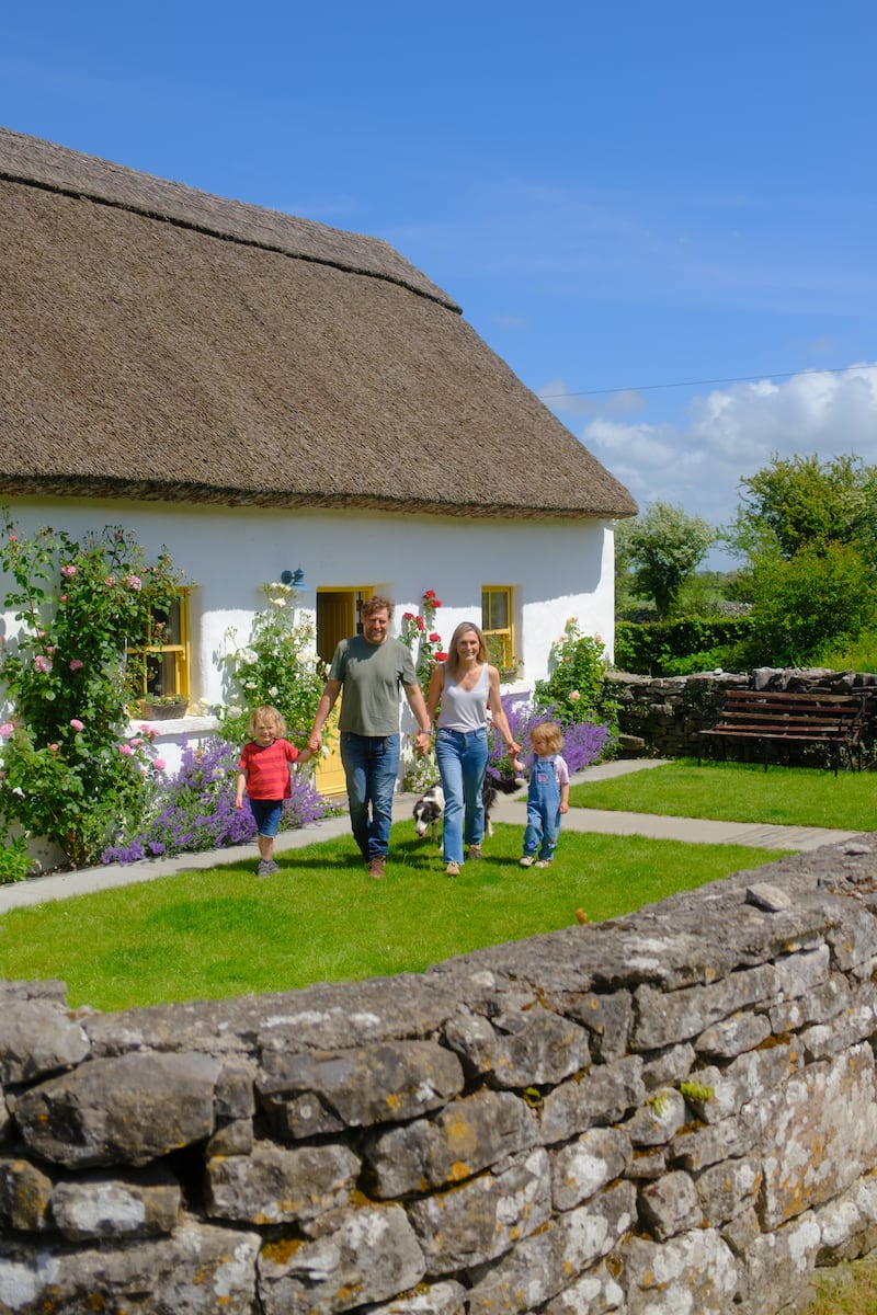 The original house on the farm is the 130-year-old thatched cottage, which was built by Mark’s ancestors. Photograph: Pedro Souza