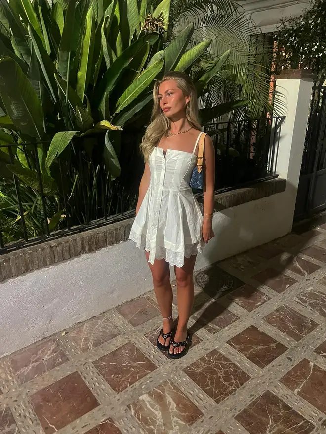 Love Island Martha Rothwell pictured posing in a white dress.
