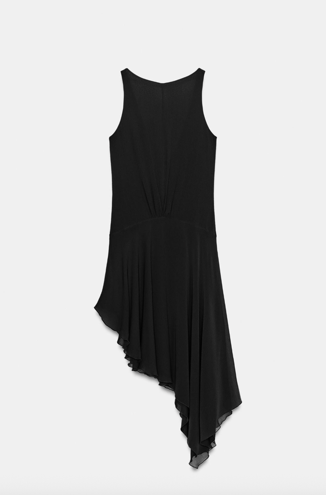 Black sleeveless dress with asymmetrical hem. black sleeveless dress with asymmetrical hem.